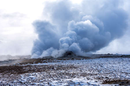 Winter landscape view of the geothermal region Hverir near Myvatn Lake in Iceland. A geothermal area with boiling mud pools and steaming fumaroles Hverir near Myvatn Lake in Iceland.の写真素材