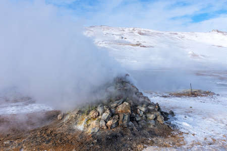 Winter landscape view of the geothermal region Hverir near Myvatn Lake in Iceland. A geothermal area with boiling mud pools and steaming fumaroles Hverir near Myvatn Lake in Iceland.の写真素材
