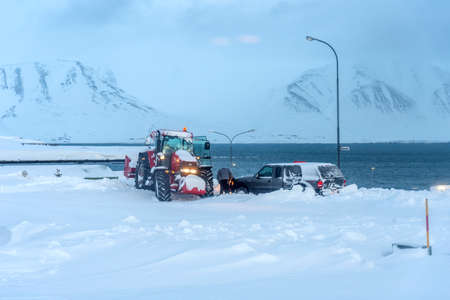 Arskogssandur, Iceland - March 15, 2020: The process of taking out a stuck car in the snow. Winter problems with the car after a heavy snowfall.のeditorial素材