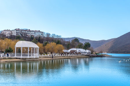 Beautiful view of the shore of Lake Abrau in early spring. Picturesque view of embankment of lake...