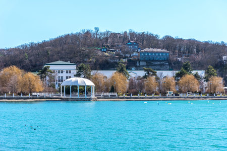 Beautiful view of the shore of Lake Abrau in early spring. Picturesque view of embankment of lake Abrau on sunny spring day in Abrau Durso.の写真素材