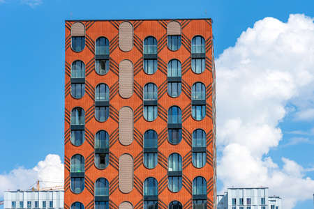 Moscow, Russia - June 14, 2021: The facade of a new modern house in the residential complex Zilart. New building in the southern district of Moscow.のeditorial素材