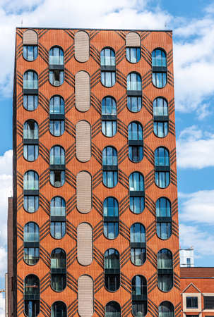 Moscow, Russia - June 14, 2021: The facade of a new modern house in the residential complex Zilart. New building in the southern district of Moscow.のeditorial素材