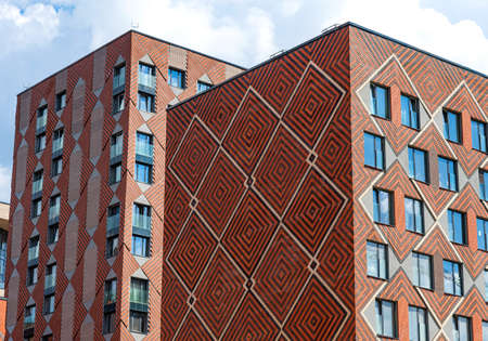 Moscow, Russia - June 14, 2021: The facade of a new modern house in the residential complex Zilart. New building in the southern district of Moscow.のeditorial素材