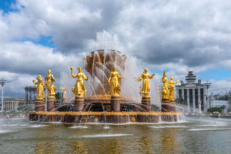 Moscow, Russia - june 30, 2021: The Friendship of Nations fountain, the main fountain and one of the main symbols VDNH in Moscow. Fountain with golden statues.のeditorial素材