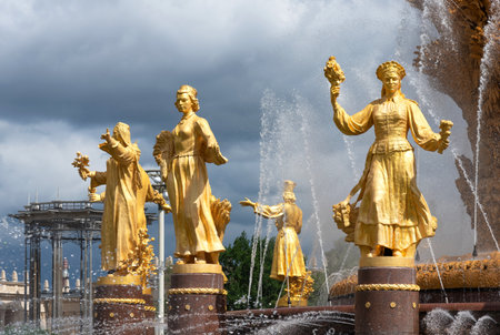 Moscow, Russia - june 30, 2021: The Friendship of Nations fountain, the main fountain and one of the main symbols VDNH in Moscow. Fountain with golden statues.のeditorial素材