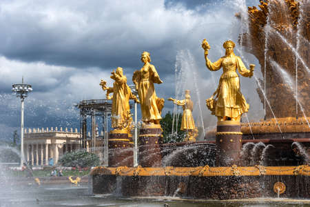 Moscow, Russia - june 30, 2021: The Friendship of Nations fountain, the main fountain and one of the main symbols VDNH in Moscow. Fountain with golden statues.のeditorial素材