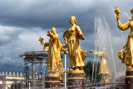 Moscow, Russia - june 30, 2021: The Friendship of Nations fountain, the main fountain and one of the main symbols VDNH in Moscow. Fountain with golden statues.のeditorial素材