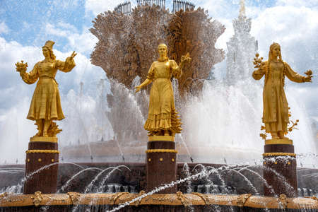 Moscow, Russia - june 30, 2021: The Friendship of Nations fountain, the main fountain and one of the main symbols VDNH in Moscow. Fountain with golden statues.のeditorial素材