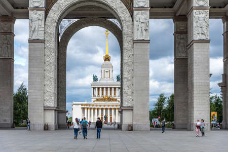 Moscow, Russia - June 30, 2021: Panoramic view of the Main Entrance to VDNKh and walking people in sunny weather in Moscow.のeditorial素材