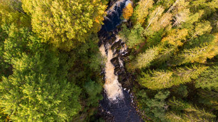 A beautiful view of Jukankoski the highest waterfalls in the Northern Ladoga area. Picturesque autumn view of White Bridges Waterfall in Kareliaの写真素材