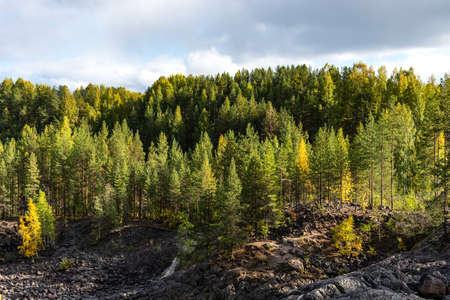 Picturesque autumn view of ancient volcano Girvas. Panoramic view of Girvas, the most ancient crater of volcano in Karelia, Russia.の写真素材