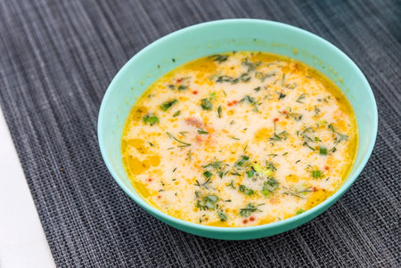 Karelian and Finnish national dish, traditional fish soup lohikeitto with salmon and cream. Salmon soup in a bowl close-up.の写真素材