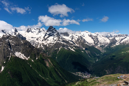 Picturesque summer landscape in Dombay with amazing snow-capped peaks of North Caucasus Mountains....