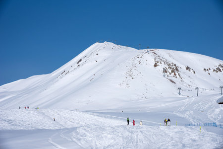 Winter view of the Caucasus Range in Gudauri, Georgia. Aerial view of snow-covered ski slopes at the...