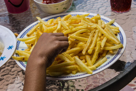 Eating potato chips.