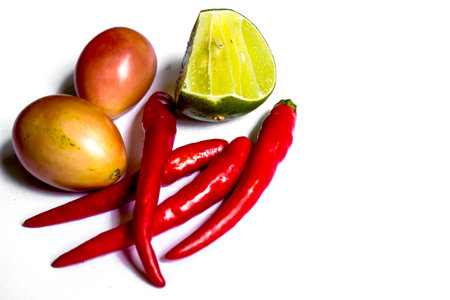 Lemon pepper and tomatoes.の写真素材