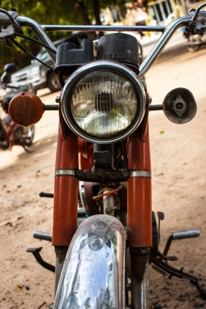 Light orange old motorcycle in asiaの写真素材