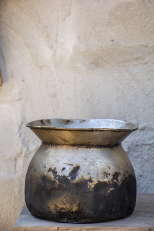The Old pot, white walls, concrete floors, old, black.の写真素材