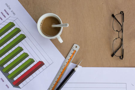 Background, blackboard, ruler, coffee, glasses, wood floors.の写真素材