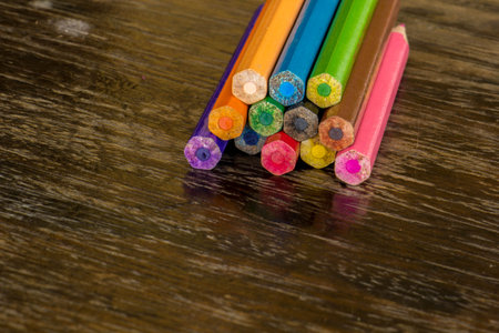 Sort crayons flooring surfaces, bright colors, red, yellow, black, orange and green.