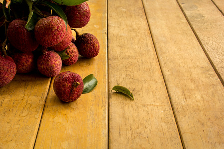 Lychee, red, floor boards, flooring, background, texture, fruit.の写真素材