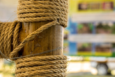 wrapped rope on wood over white background