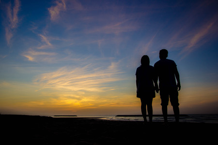 silhouette of a couple in love at sunsetの写真素材