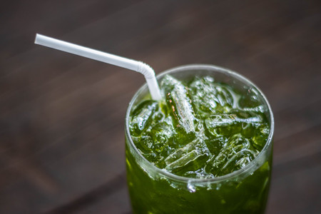 Cool green lemon tea on healthy organic wood floor.の写真素材