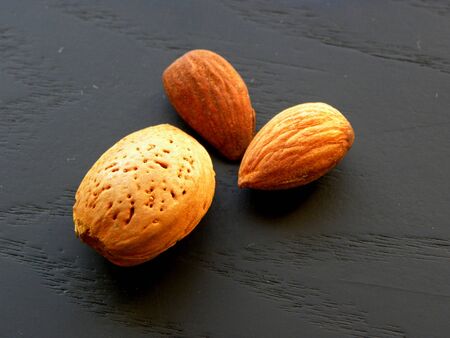 almonds close-up on a black backgroundの写真素材