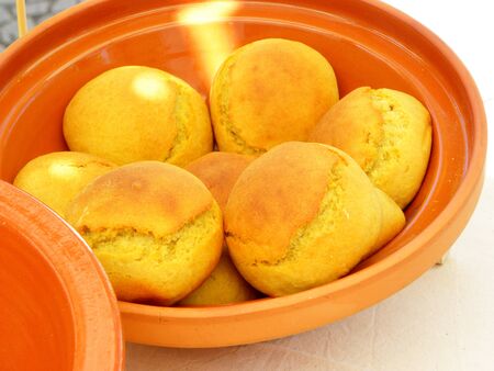 round buns in a clay bowlの写真素材