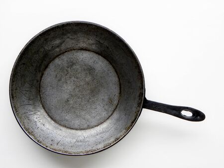 cast iron pan on a white backgroundの写真素材