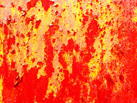 Exfoliating surface paint, exfoliating yellow and redVintage or grungy background of red and yellow...