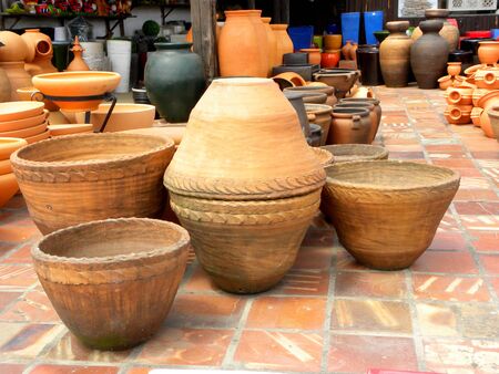 A collection of large cone-shaped ceramic flower pots. Red clay flower pots.の写真素材