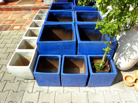 A collection of blue and white ceramic flower pots. Square flower pots.の写真素材