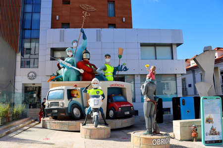 Torres Vedras, Portugal - February 2021: The famous Torres Vedras carnival is a Covid -19 theme. Figures of doctors, rescuers, bastards and policemen.のeditorial素材