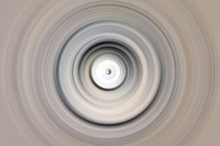 Abstract radial motion blur in grays, beige and white shades. Round pattern for design of labels, textiles, clothing or brochures. Background for modern graphic design and text.の写真素材
