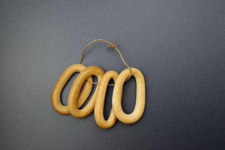 Sushki on a gray background. Traditional Russian bread product of low moisture in the shape of an ovalの写真素材