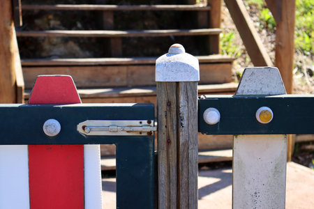 Old metal bolt on a wooden fence. Door latchの写真素材