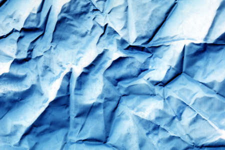 Abstract background with blue and white crumpled paper. Blue crumpled background.の写真素材