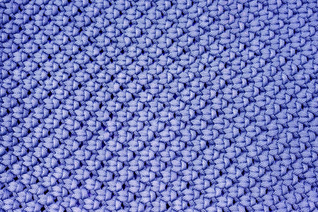 Knitted texture of blue jersey with pigtail pattern as background