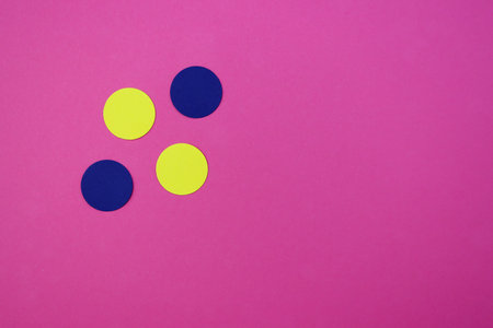 Yellow and blue circles from paper on a pink background. Abstract bright background with circles.の写真素材