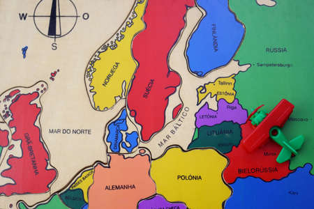 Red-green Plane stands on the map of Europe. Airplane in the colors of the flag of the Republic of Belarus stands on the border with Europe. Current events in the world.の写真素材