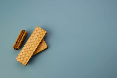 Waffles with chocolate filling on a blue background.の写真素材