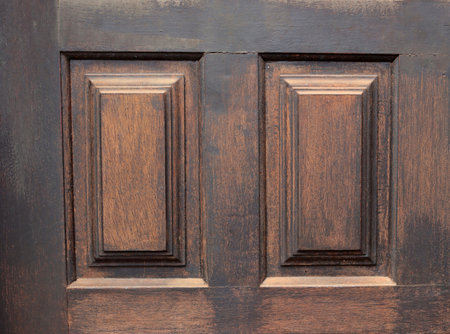 Part of a massive vintage wooden door. Brown wood texture backgroundの写真素材