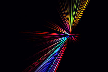 Abstract surface of blur radial zoom in blue, red, yellow tones on black background. Abstract background with multicolored radial, diverging, converging lines.の写真素材