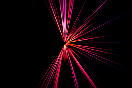 Abstract surface of radial zoom blur in pink and lilac tones on a black background. Abstract pink black background with radial, diverging, converging lines.の写真素材