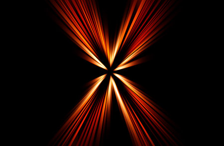 Abstract surface of blur radial zoom in orange and brown tones on a black background. Bright orange-black background with radial diverging, converging lines.の写真素材