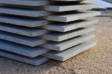 Concrete slabs stacked on top of each other. Stack of gray tiles.の写真素材