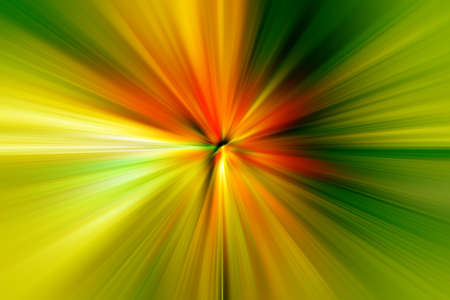 Abstract radial zoom blur surface of green and orange tones. Juicy green background with radial, radiating, converging lines.の写真素材